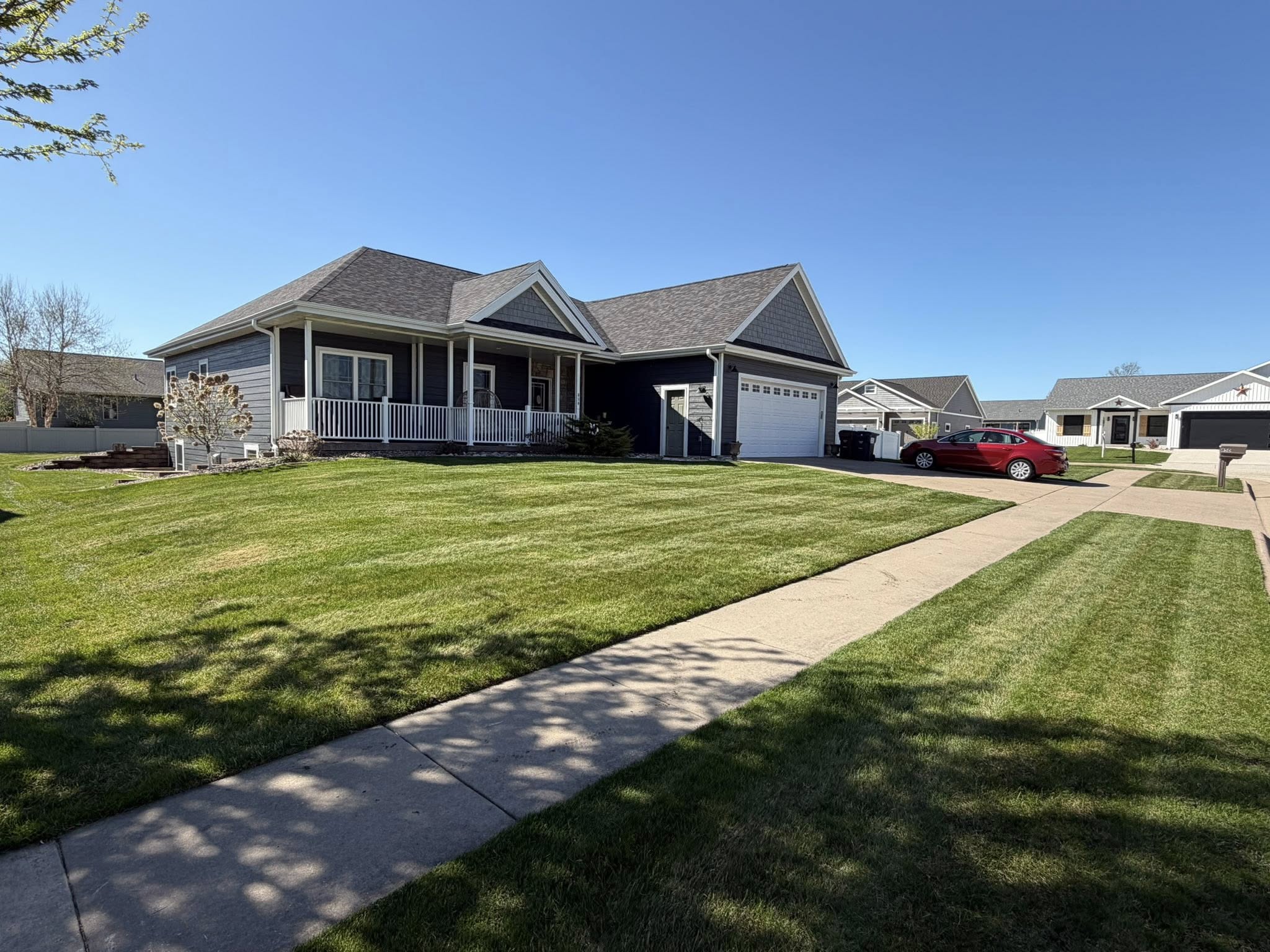 A residential lawn freshly mowed by Little Green Men